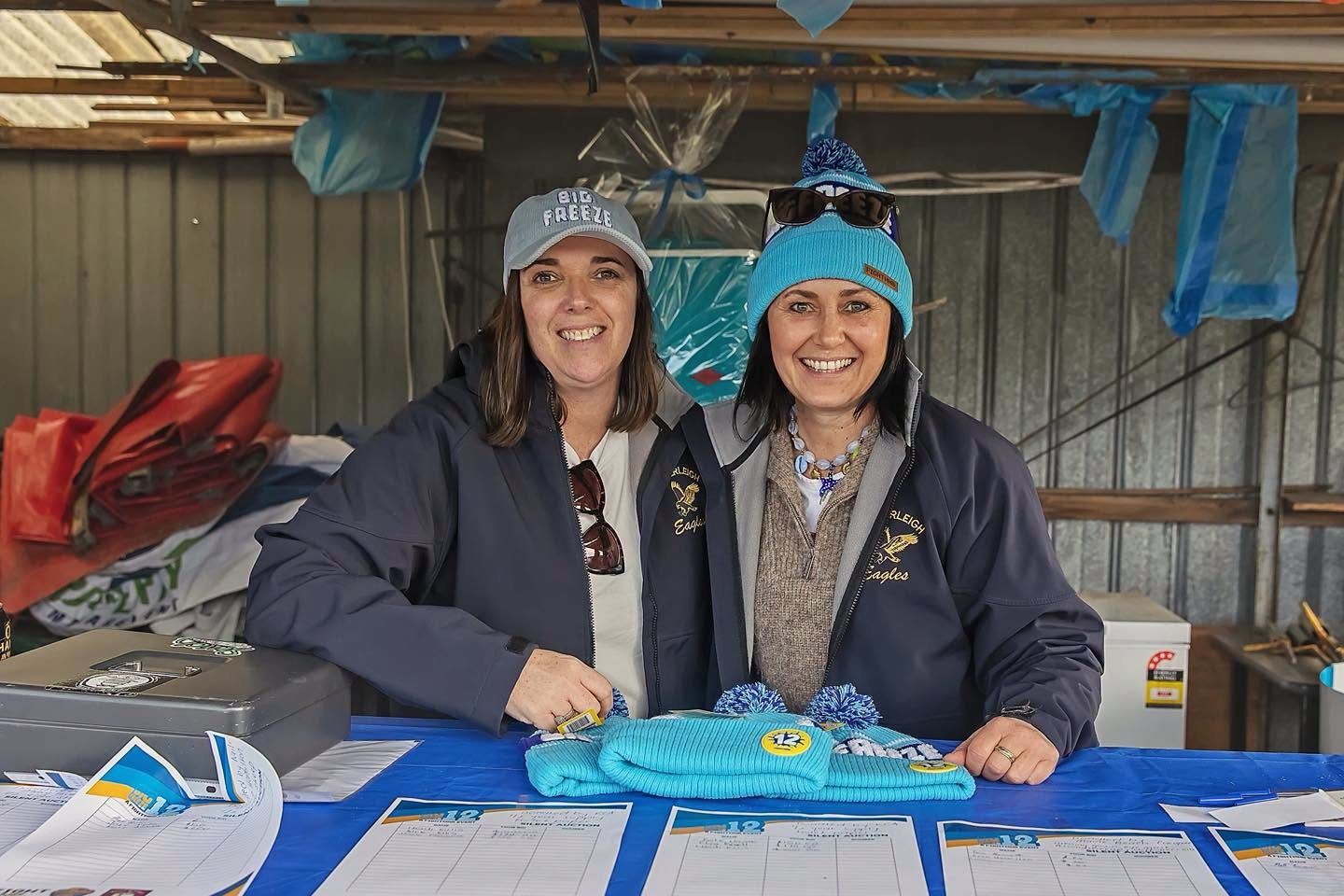 Volunteers at the FightMND Big Freeze silent auction and beanie stall