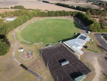 Aerial view of the Hatherleigh oval, netball courts, clubrooms with solar panels and playground