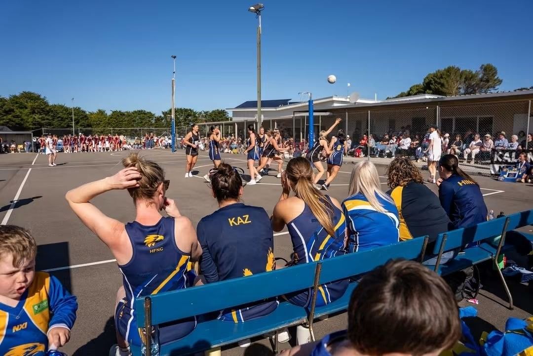 Hatherleigh netballers watch on from the bench during the 2026 grand finals