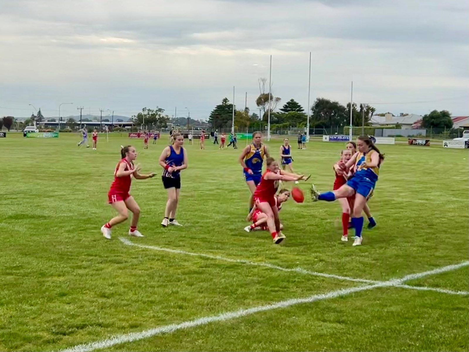 A Hatherleigh player gets her kick away under pressure