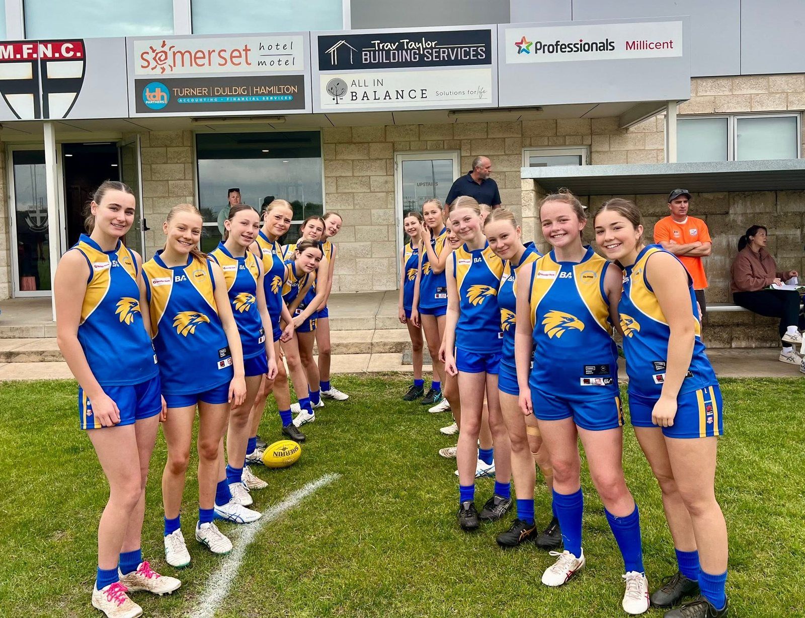 Hatherleigh girls line up with the footy before a game