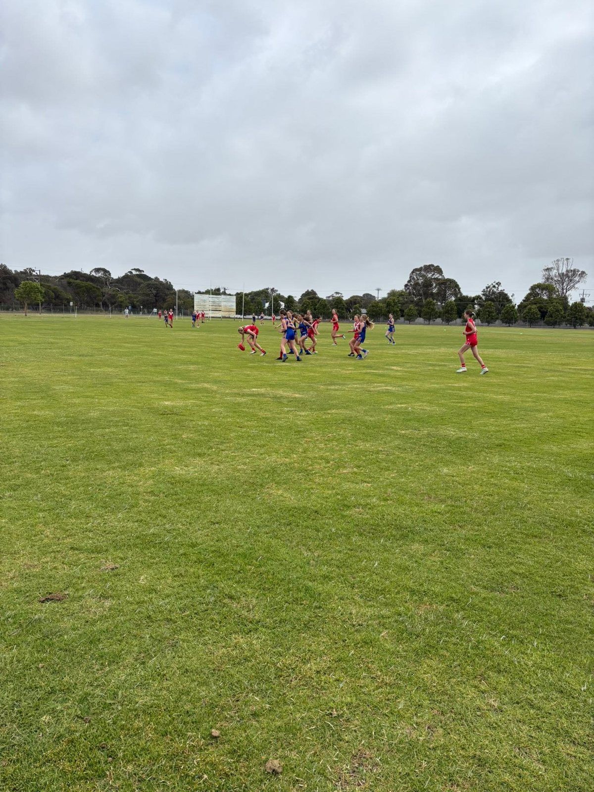 Hatherleigh girls contest the ball at ground level in an LCWFL game