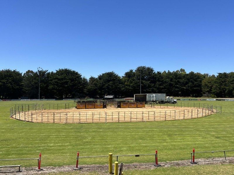 The finished rodeo arena, fenced with steel panels and yellow chutes, on the Hatherleigh oval