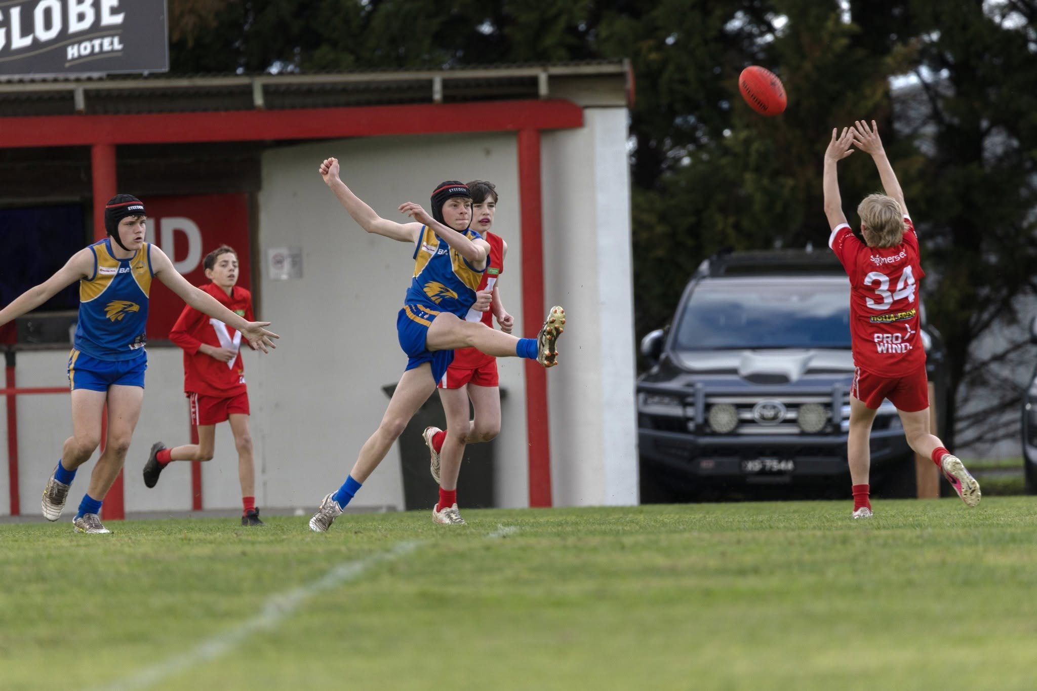 A Hatherleigh Junior Colts player kicks forward at Tantanoola