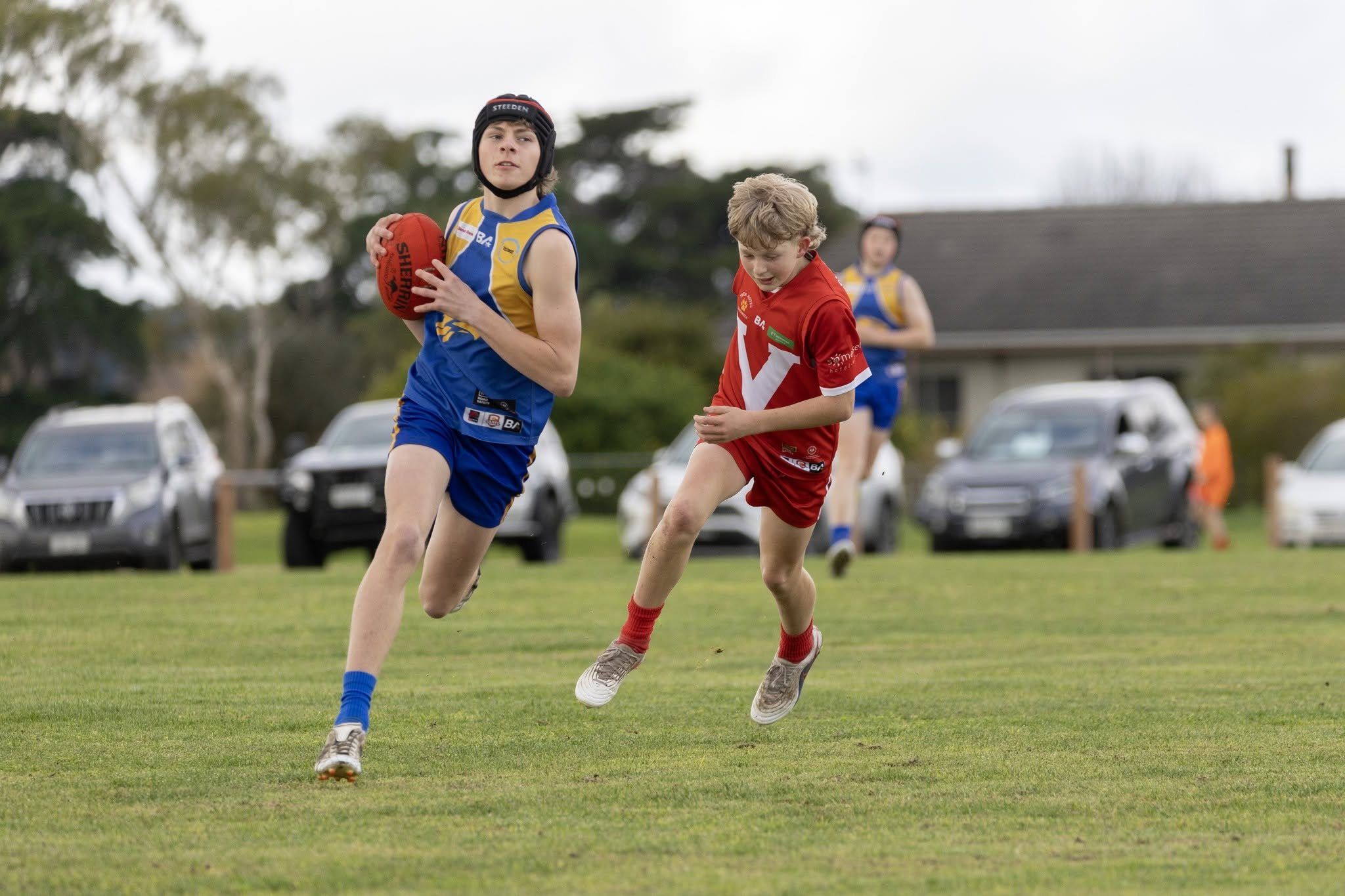 A Hatherleigh Junior Colts player runs with the ball against Tantanoola
