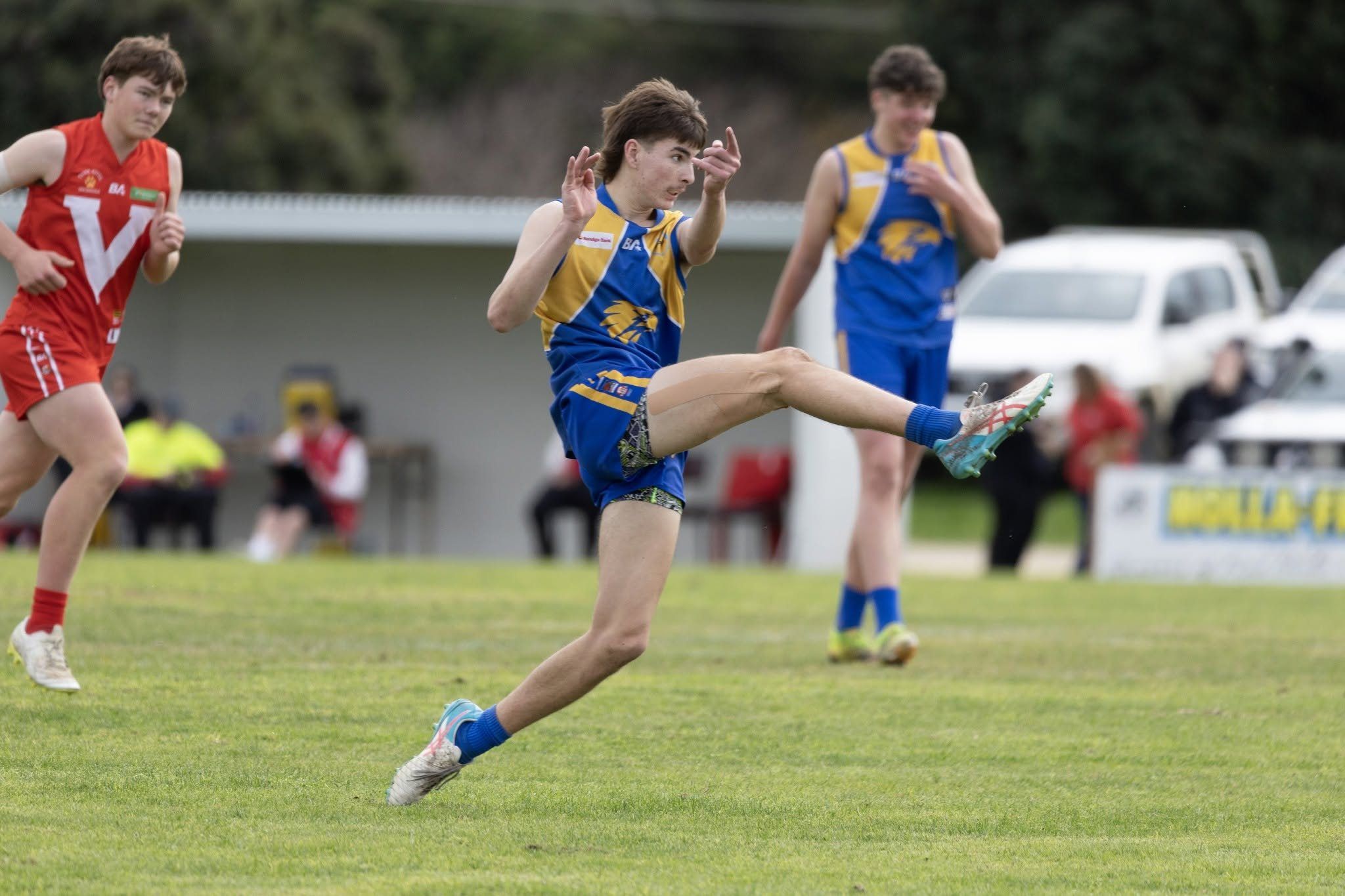A Hatherleigh Senior Colts player kicks forward at Tantanoola