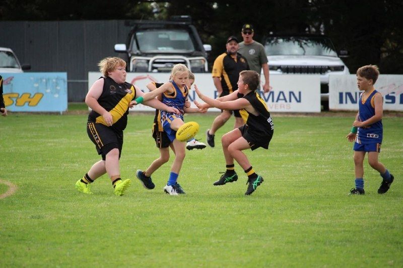 Paige Bowman kicks for Hatherleigh in the U11 football