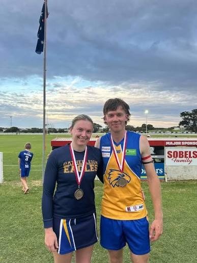 Erin Watson in her Hatherleigh Eagles netball uniform and Lewie Walker in his Hatherleigh guernsey, each wearing an Anzac Day medal